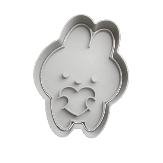 Conejo De Pascua Sosteniendo Corazon Cortante Para Galletitas